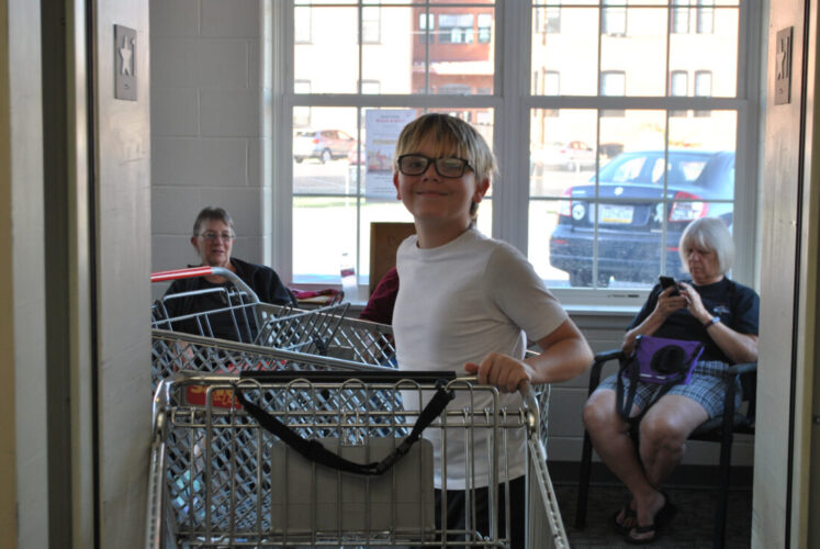 12-year-old honors late father’s legacy as local food bank volunteer